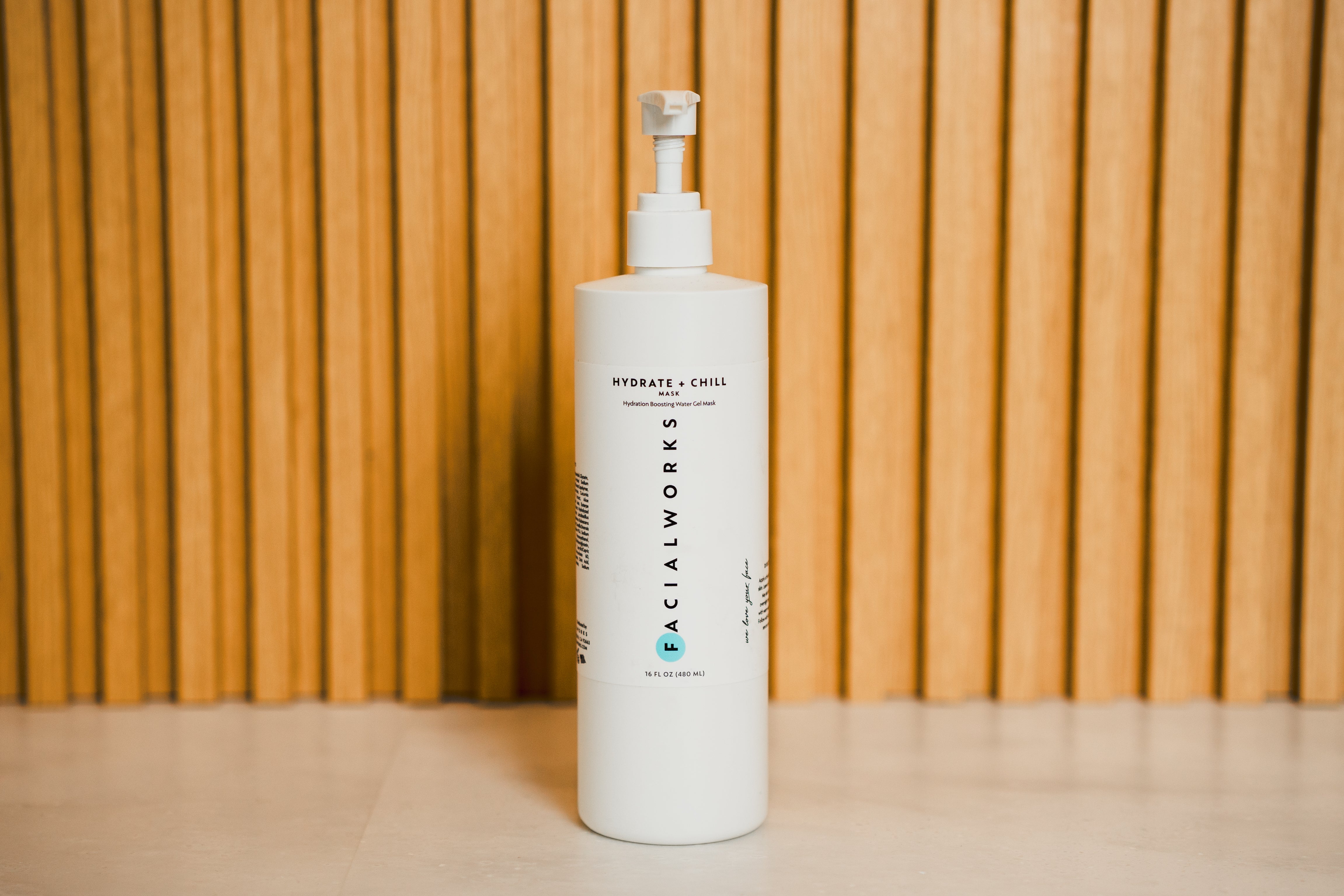 A single green leaf against a white background.